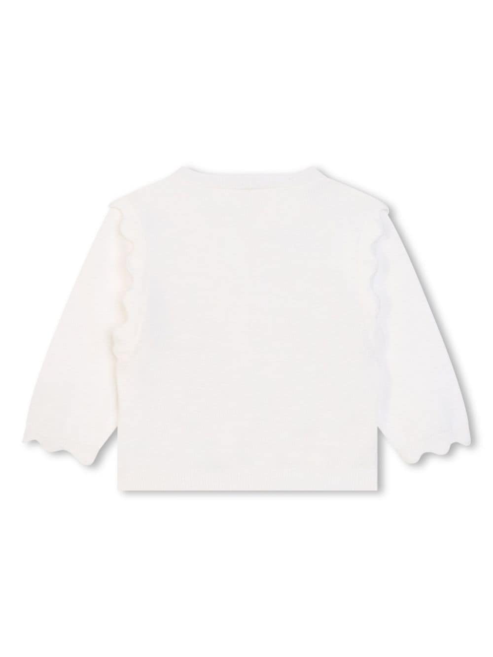 Baby girl's white cardigan with flared edges