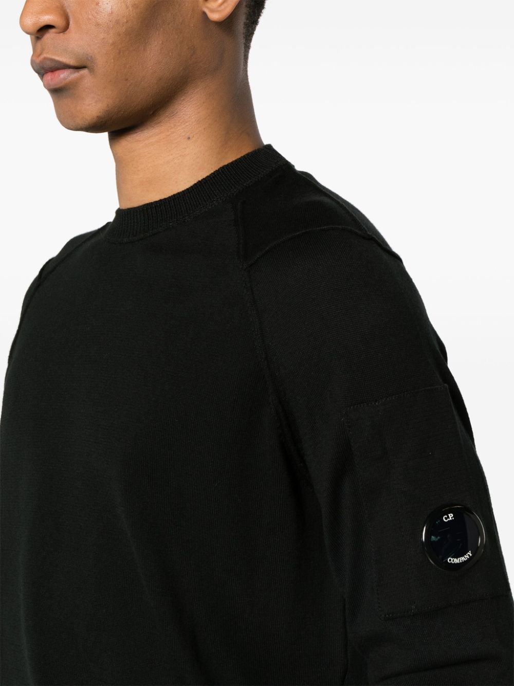 Black sweater with Lens logo pocket and reverse stitching