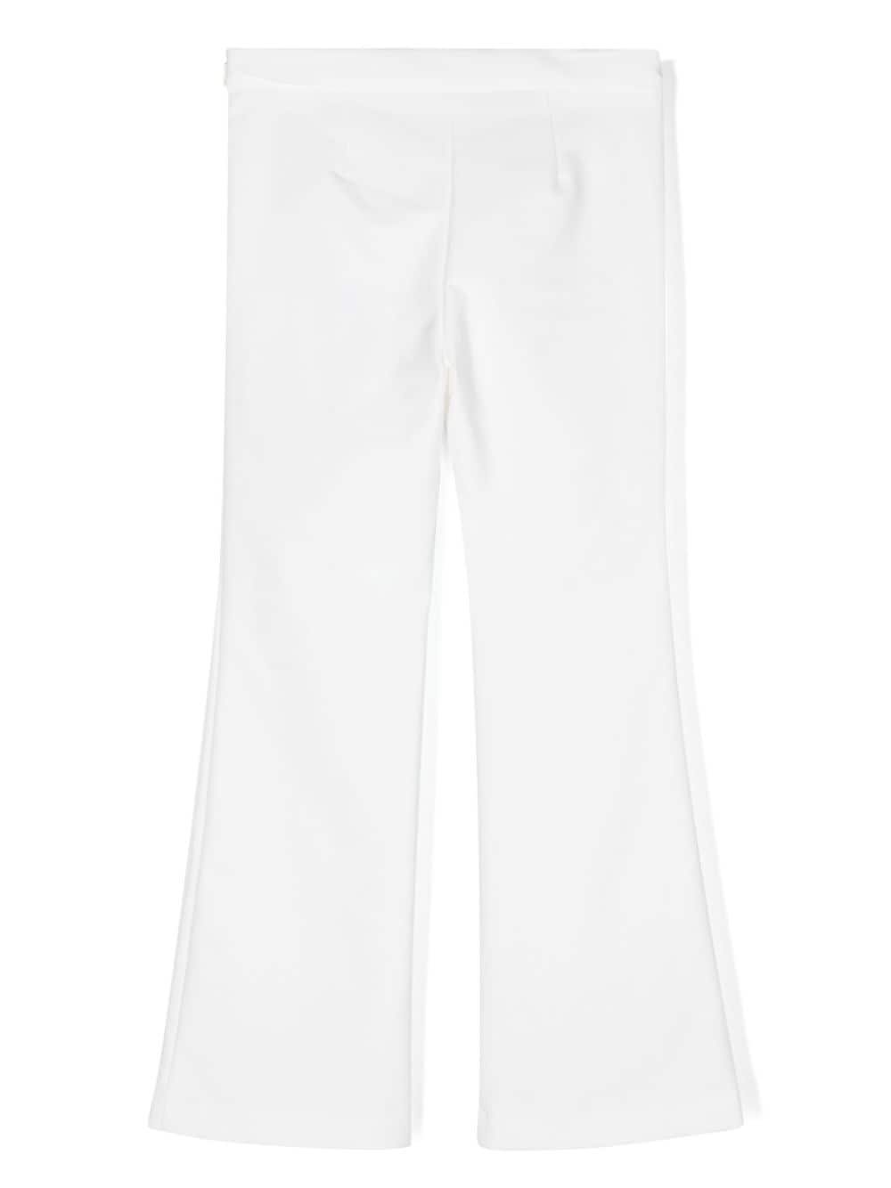 White trousers with front bows