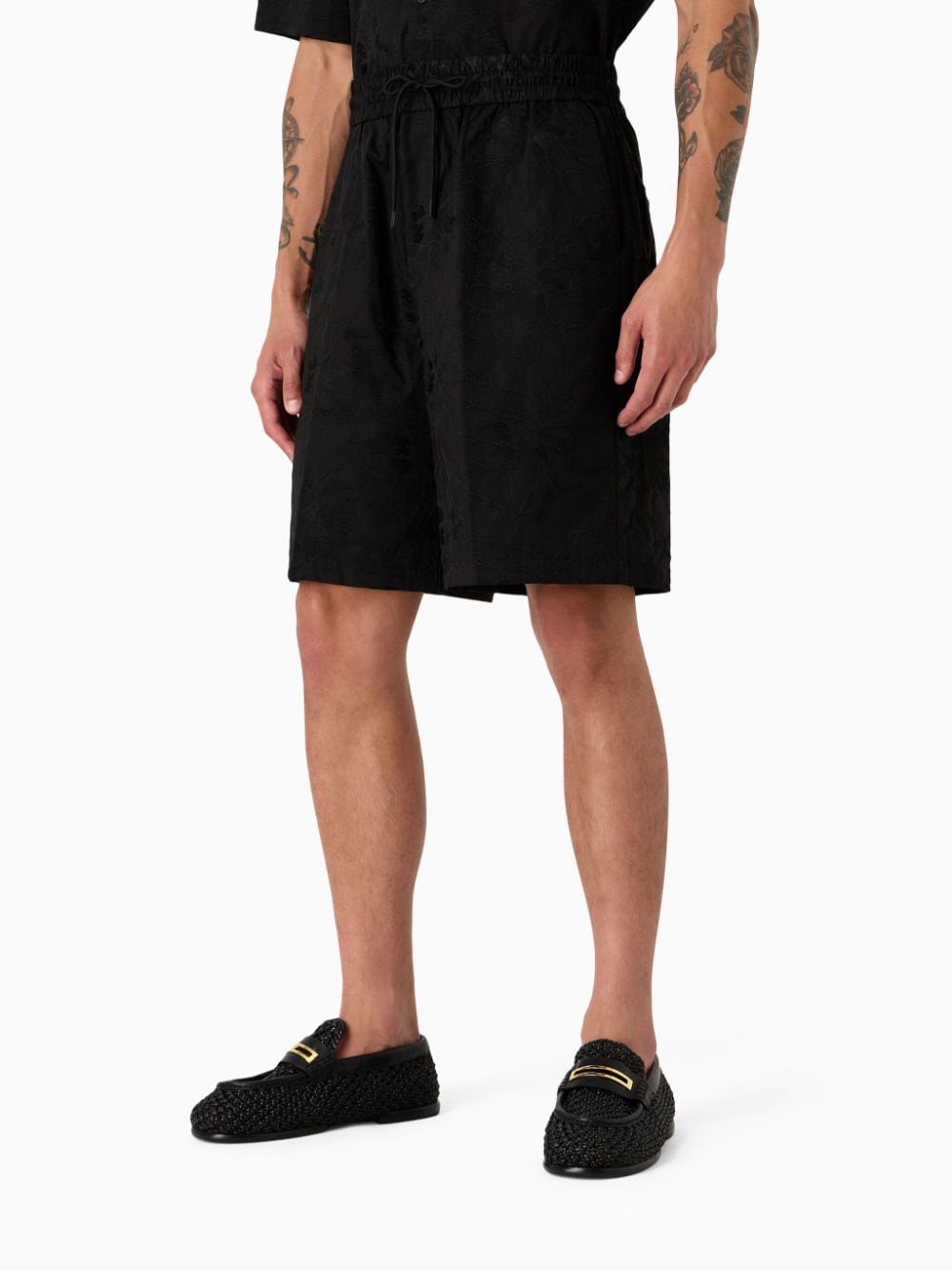 Black Bermuda shorts with embroidered pattern