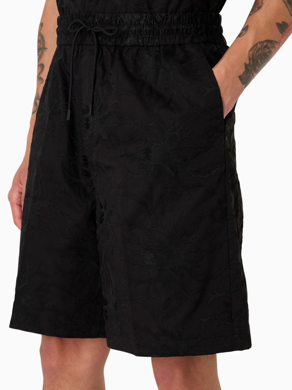 Black Bermuda shorts with embroidered pattern