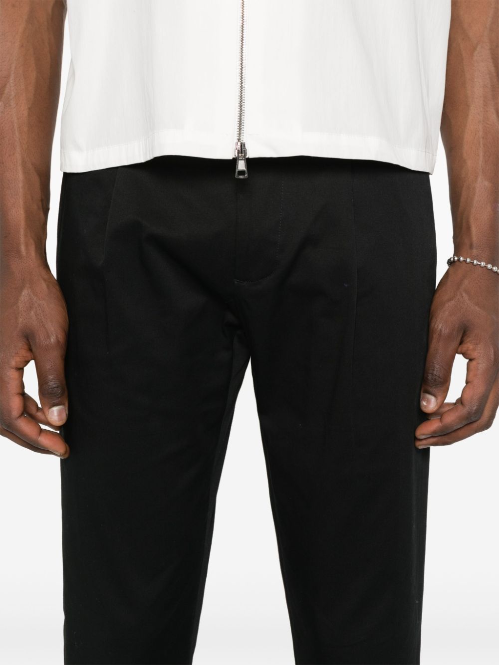 Black trousers with pleat