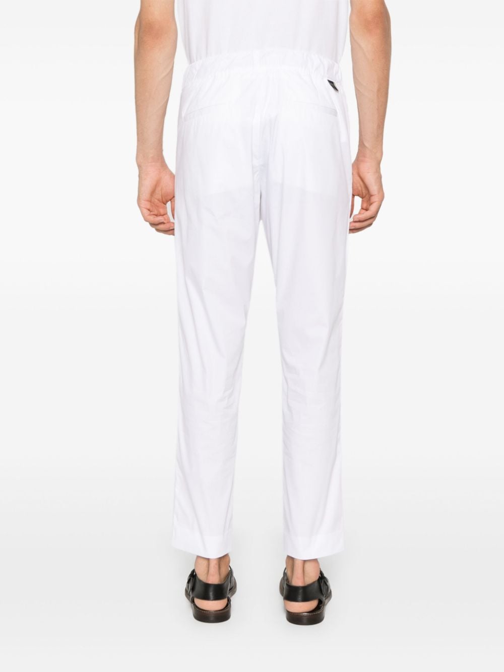 Tapered white trousers