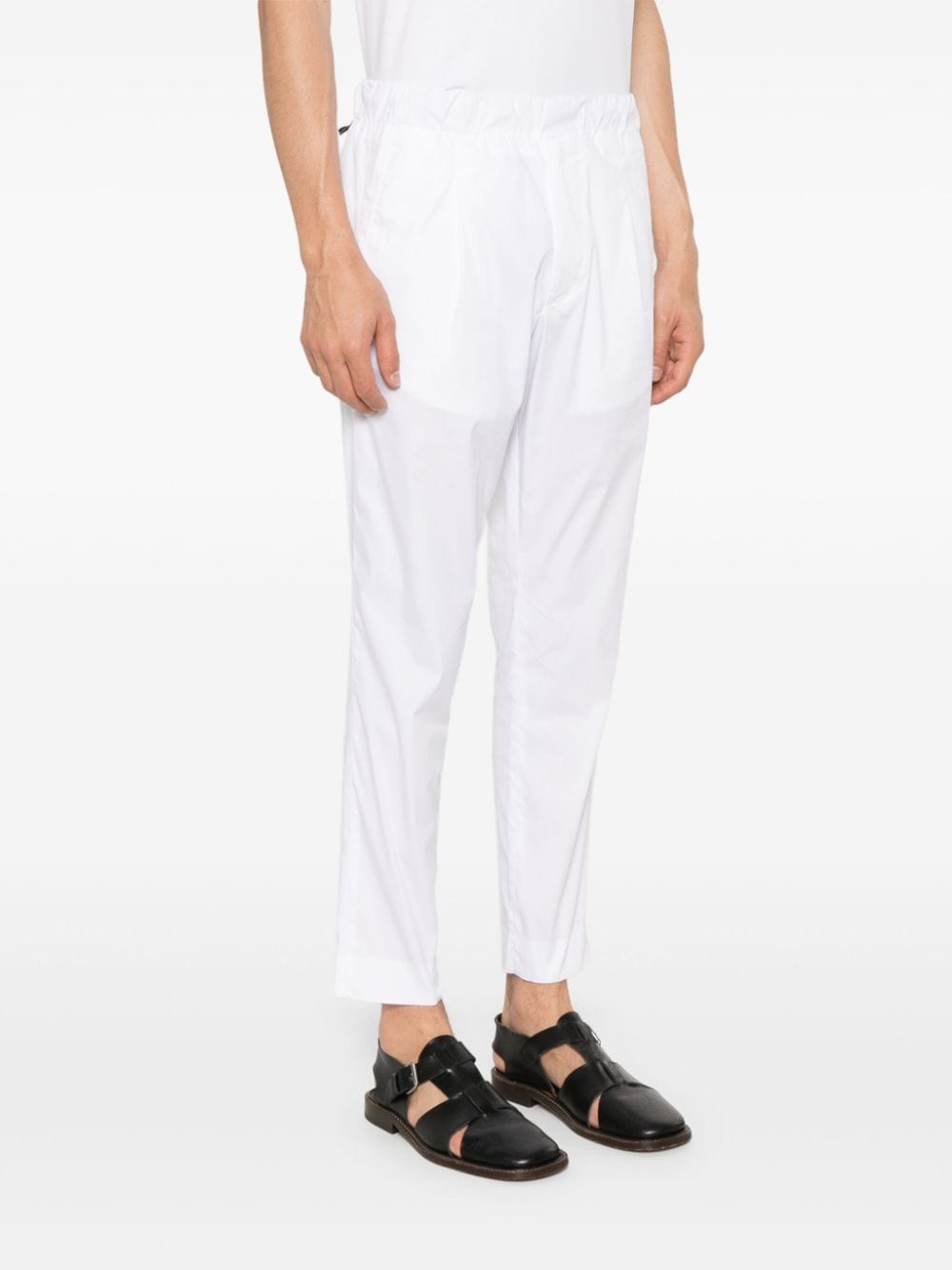 Tapered white trousers