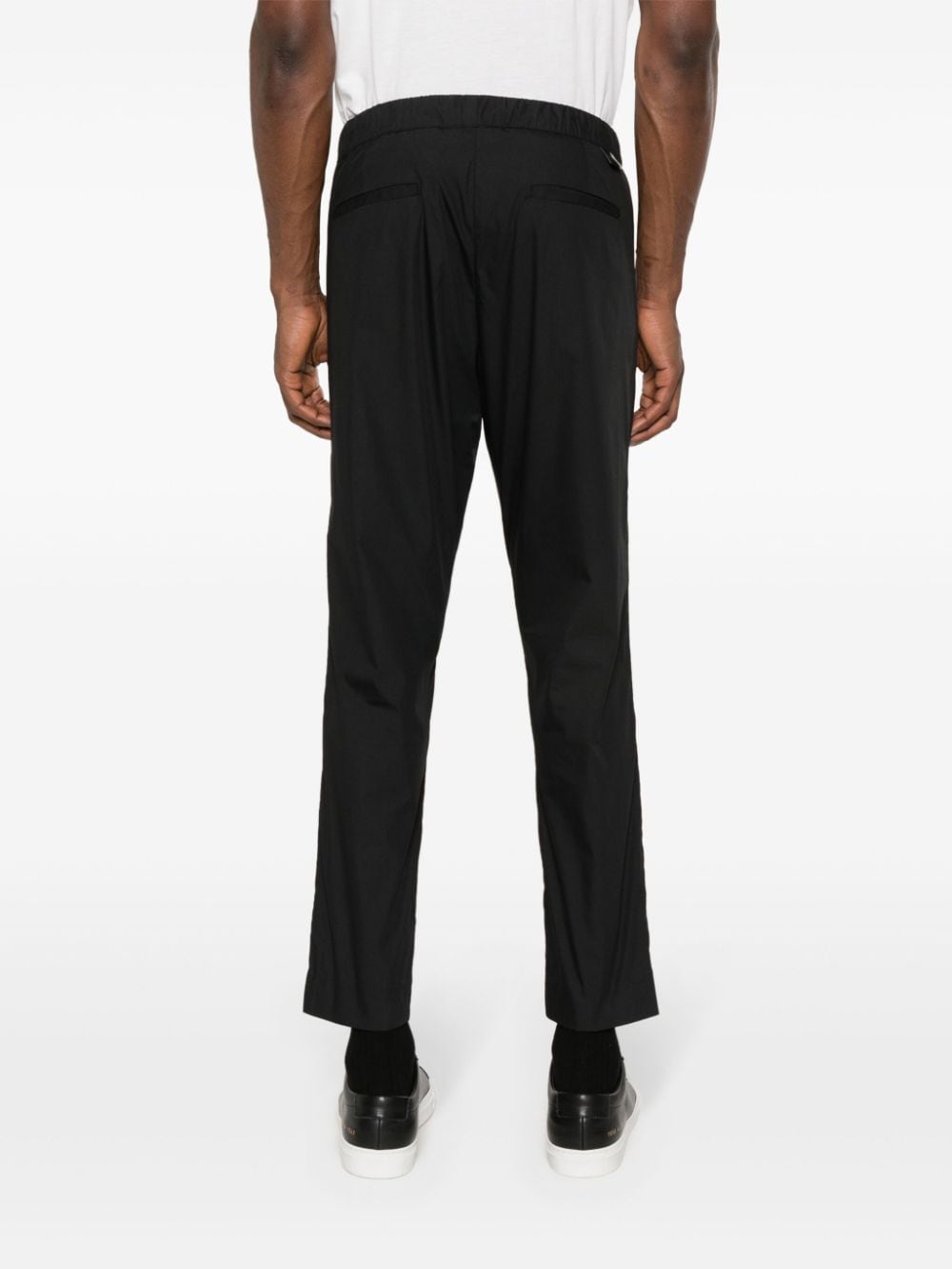 Black tapered trousers