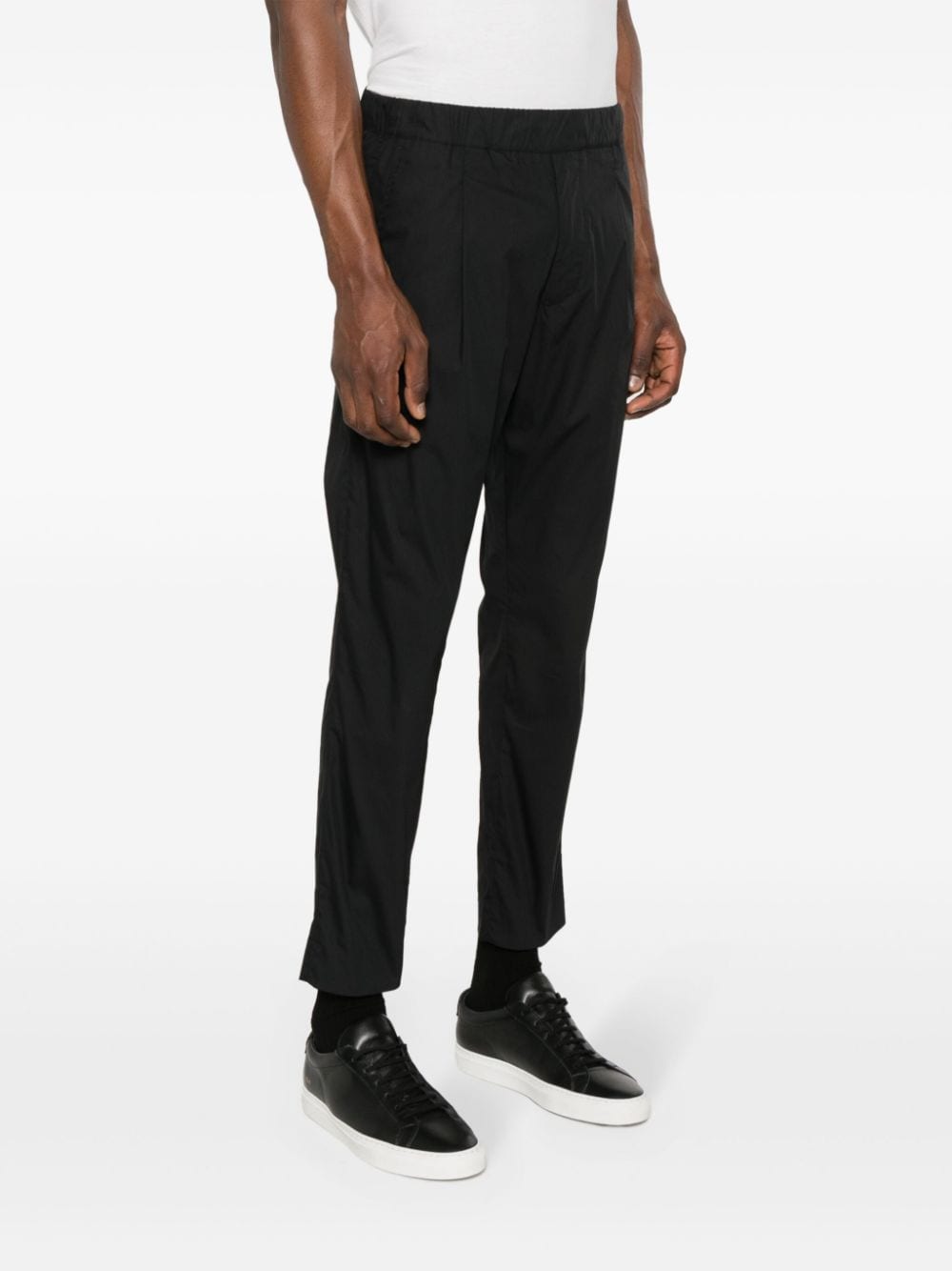 Black tapered trousers