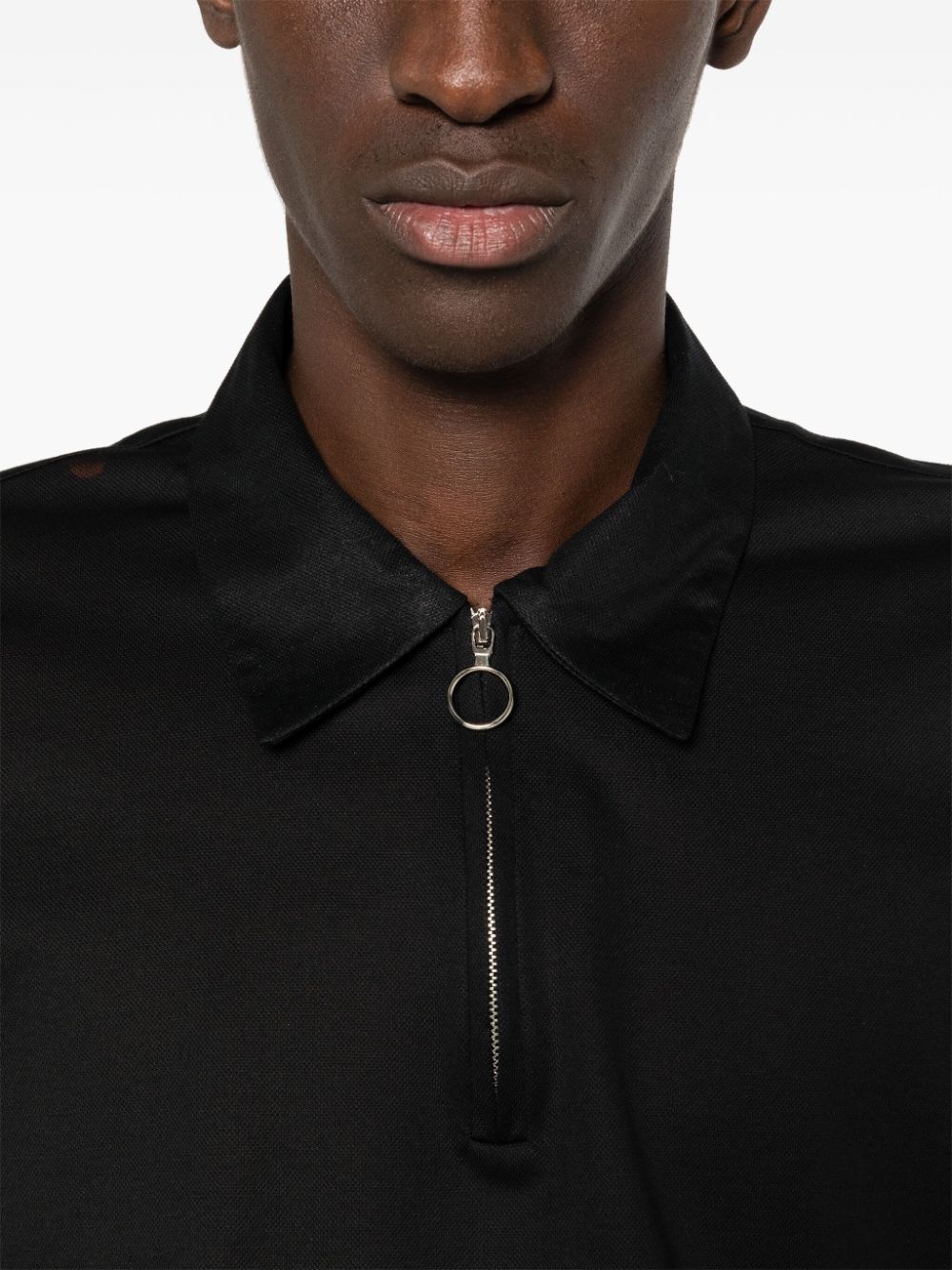 Black polo shirt with half front zip