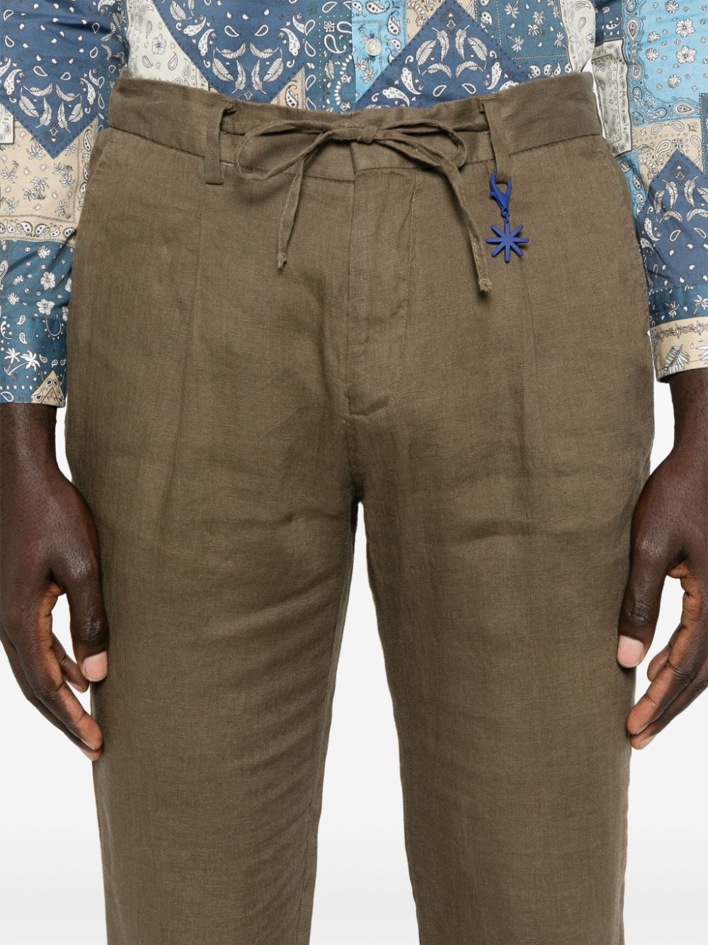 Green tapered linen trousers