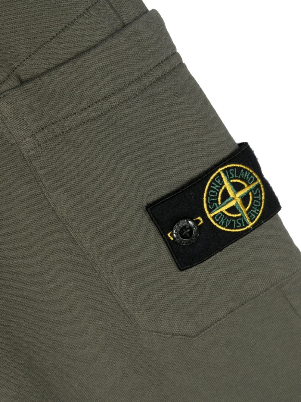 Green Compass label trousers