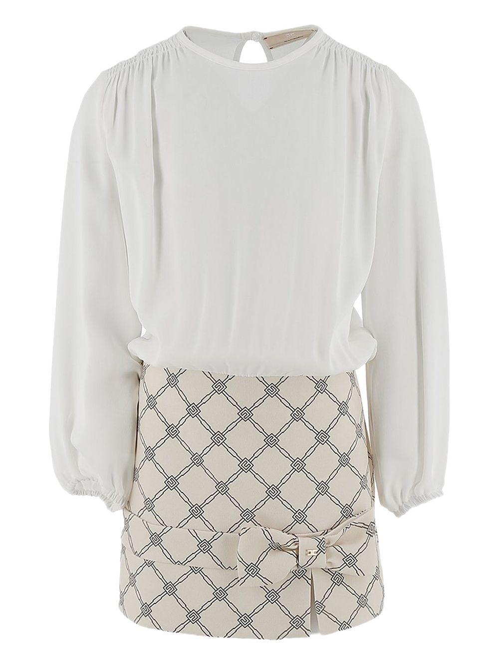 Abito avorio con blusa e gonna logata