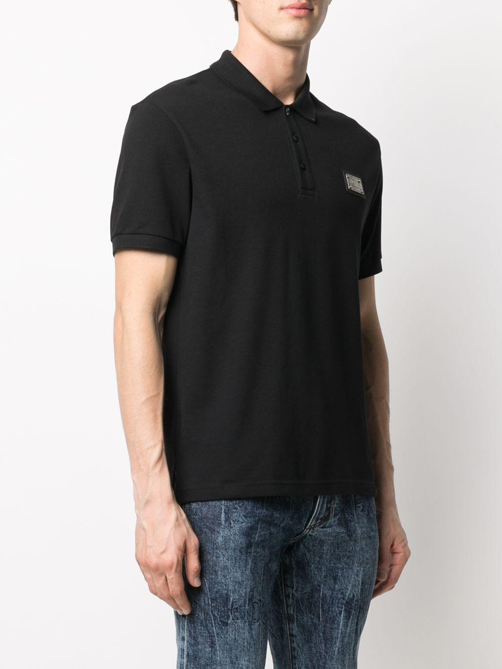 Polo nera mini placca logo petto
