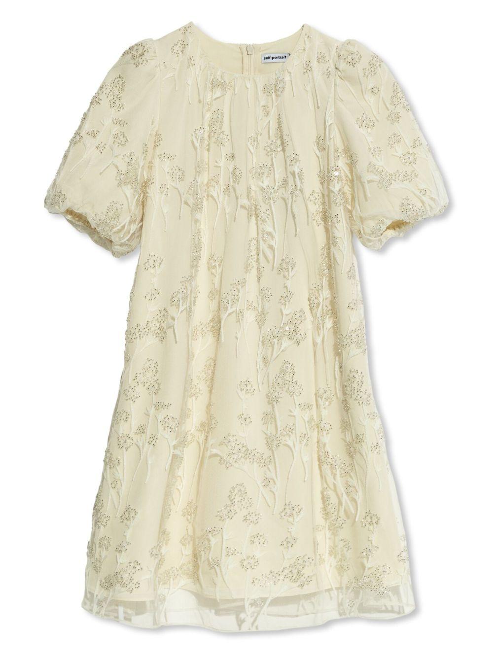 Abito crema in tulle e macramè
