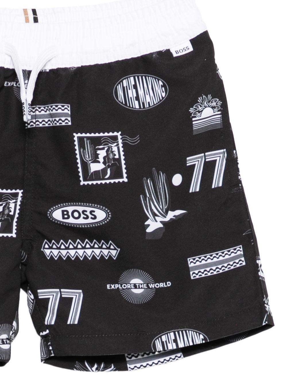 Boxer da bagno con stampa all over J52840 09B BOSS KIDSWEAR 