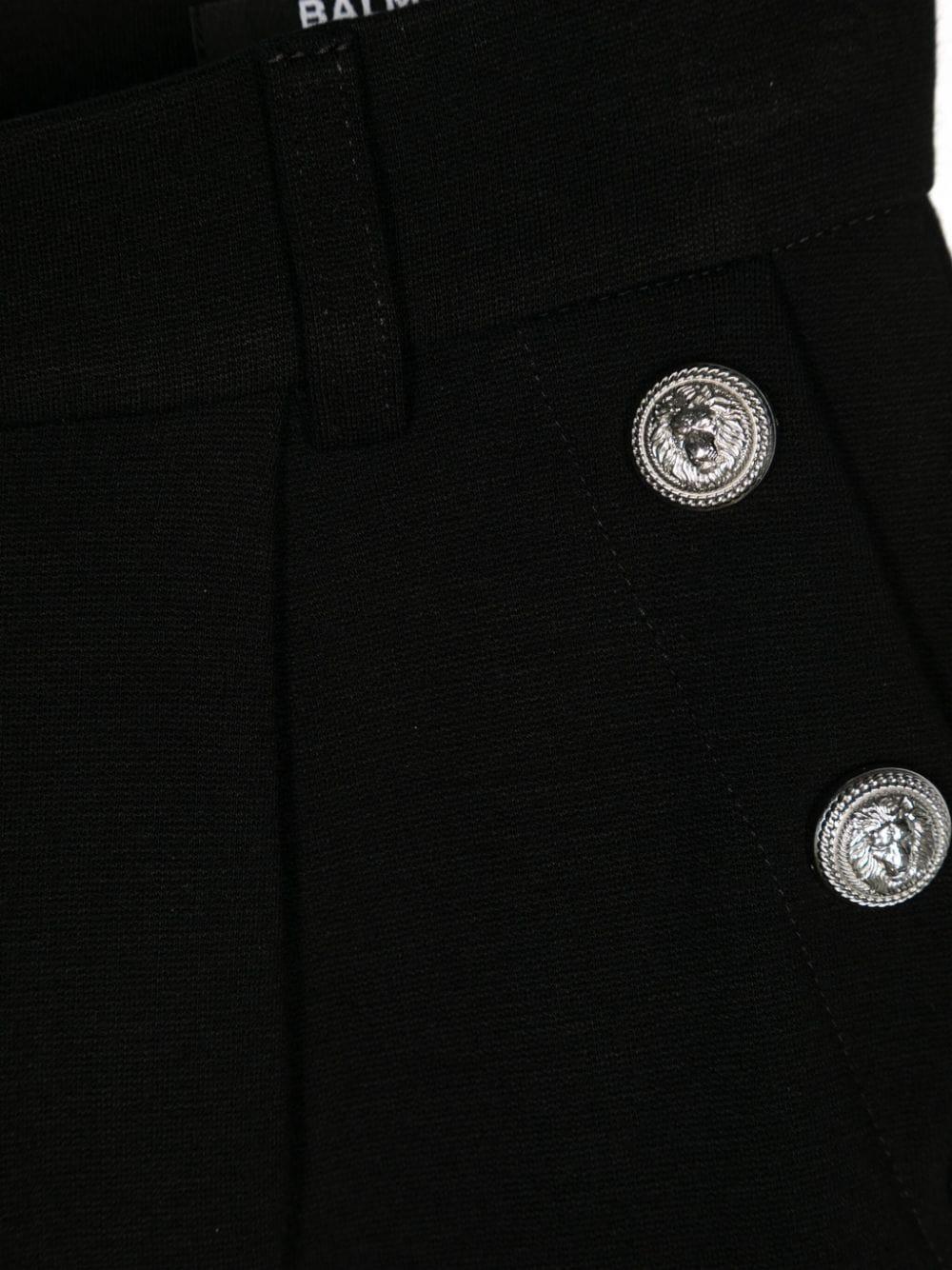 Pantalone nero gamba ampia bottoni logati