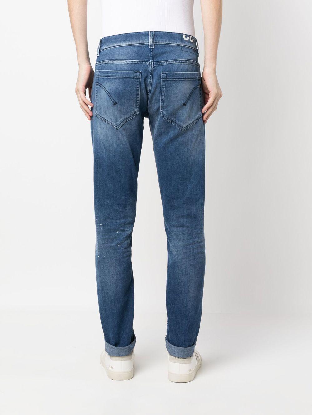 Jeans blu con schizzi di pittura
