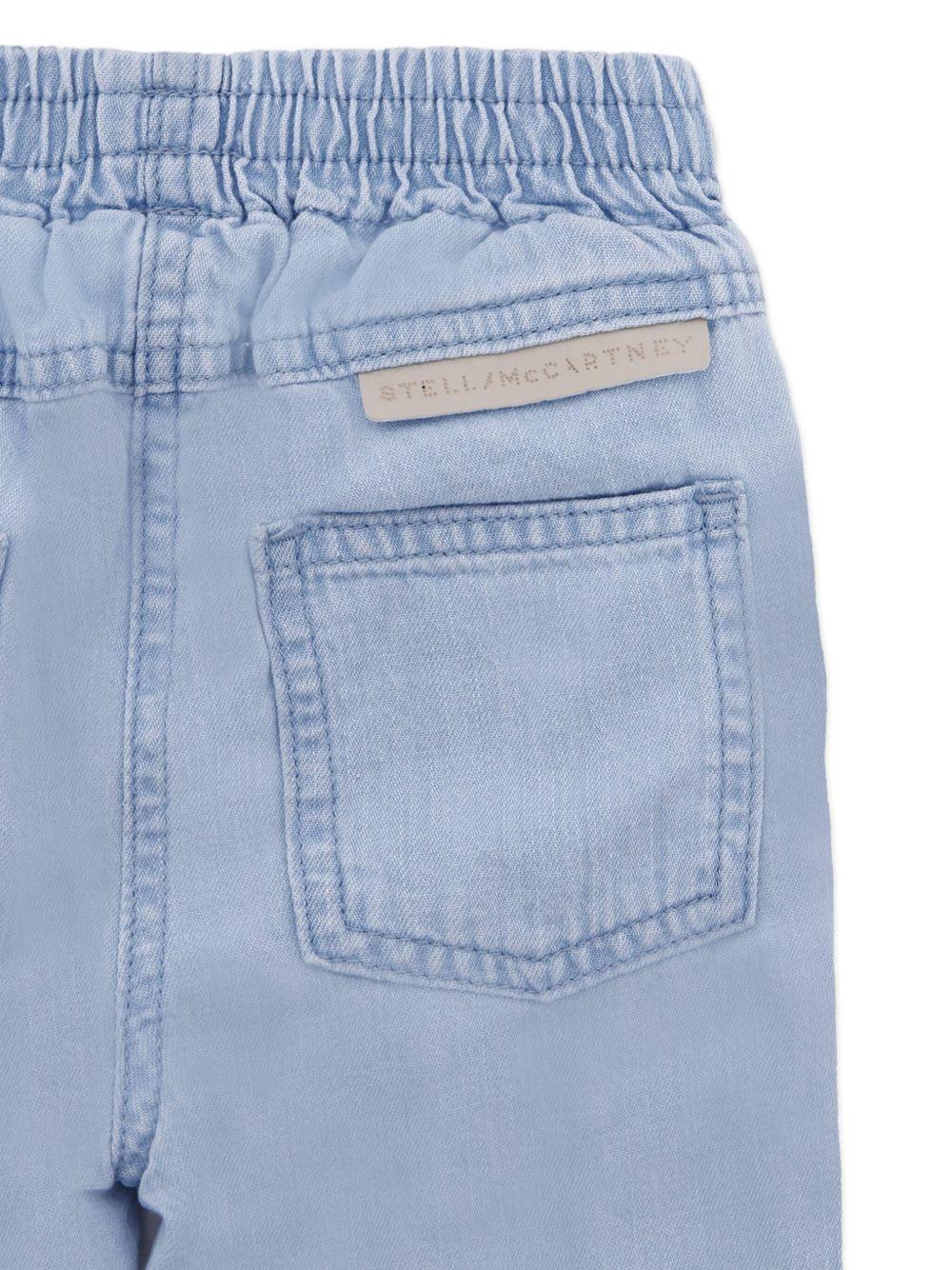 Jeans Azzurri con Ruches e Decorazioni a Fiori TX6020Z0522 606 STELLA MCCARTNEY KIDS 