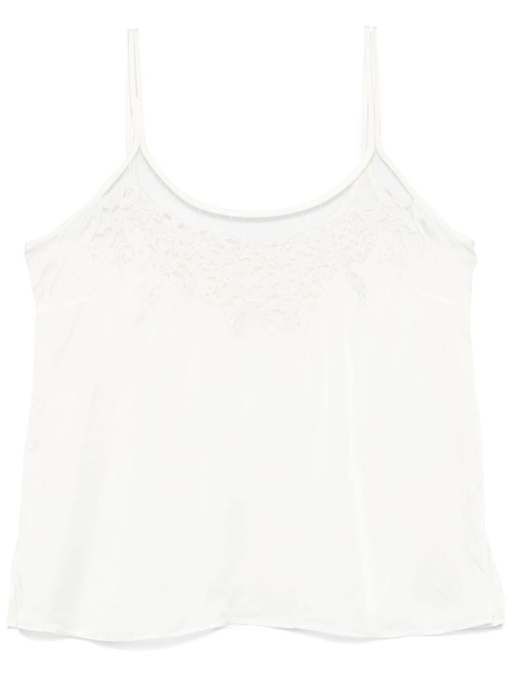 Top bianco con ricami e trasparenze