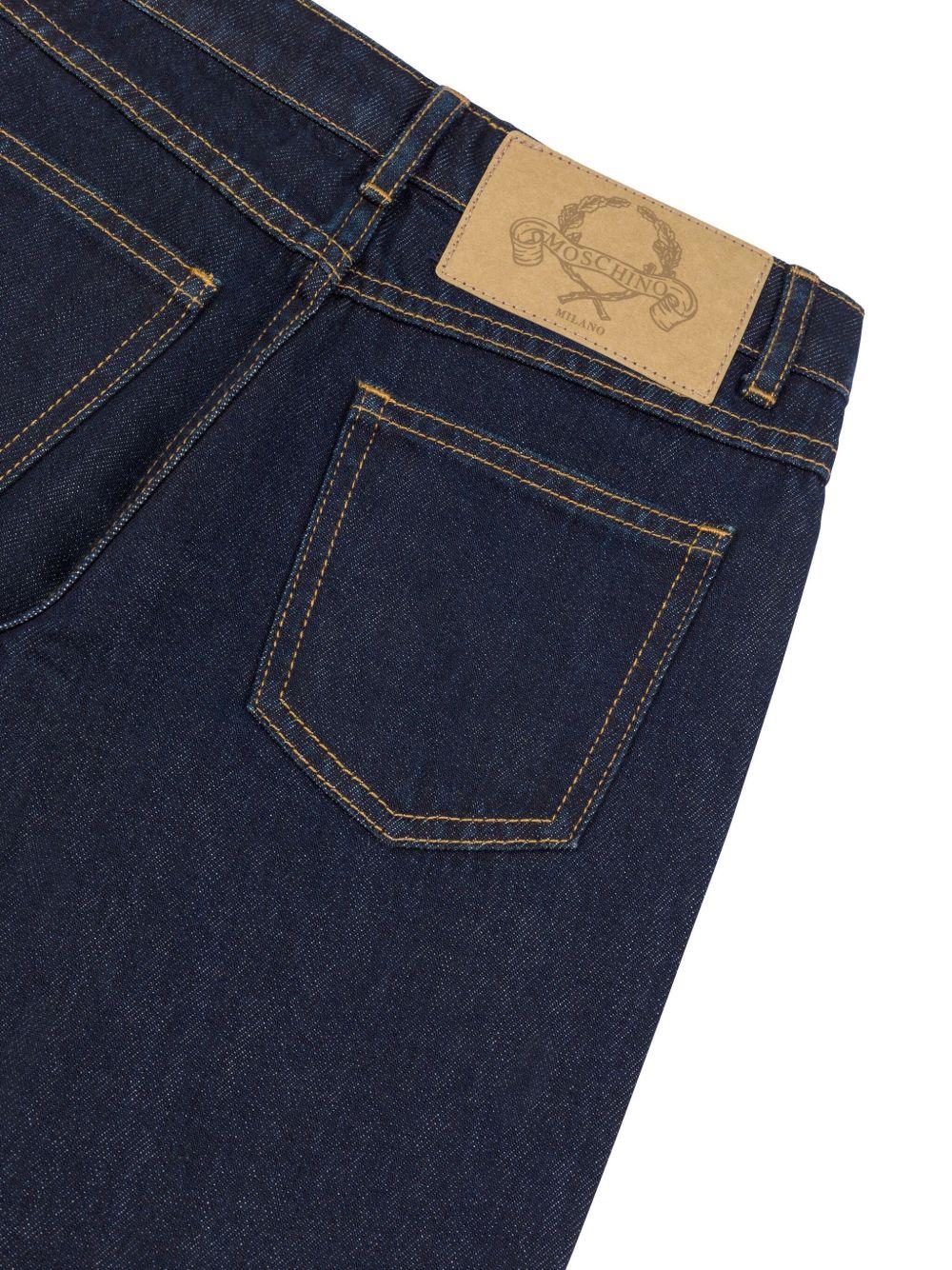 Jeans a zampa  lavaggio scuro HDP06KL0E36 40134 MOSCHINO KIDS 