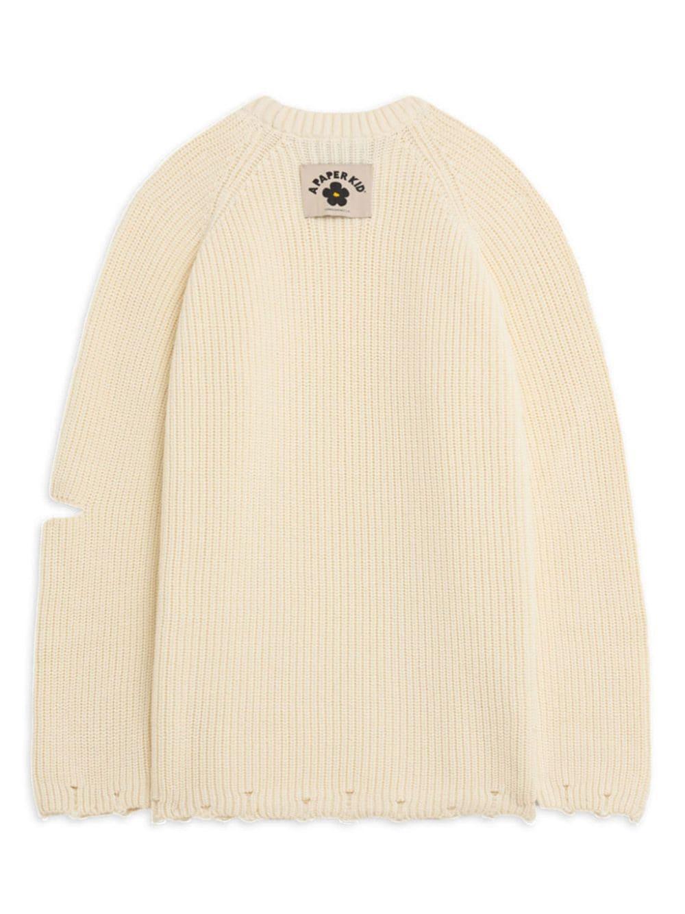 Maglione crema dettagli cut-out