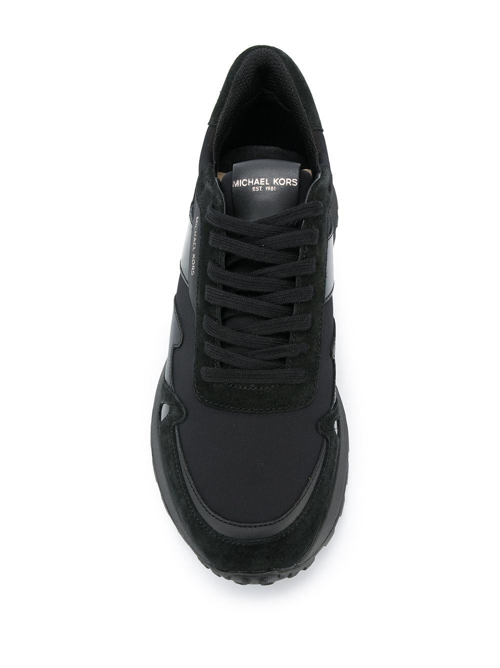 Sneakers nera inserti in pelle e tessuto
