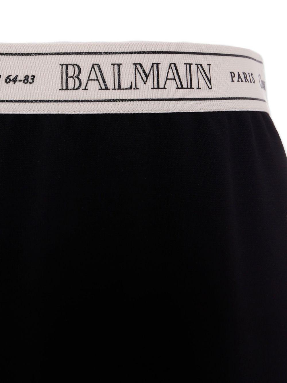 Gonna Bambina in Jersey Nero con Logo e Spacco Laterale BX7A34J0371 930AV BALMAIN KIDS 
