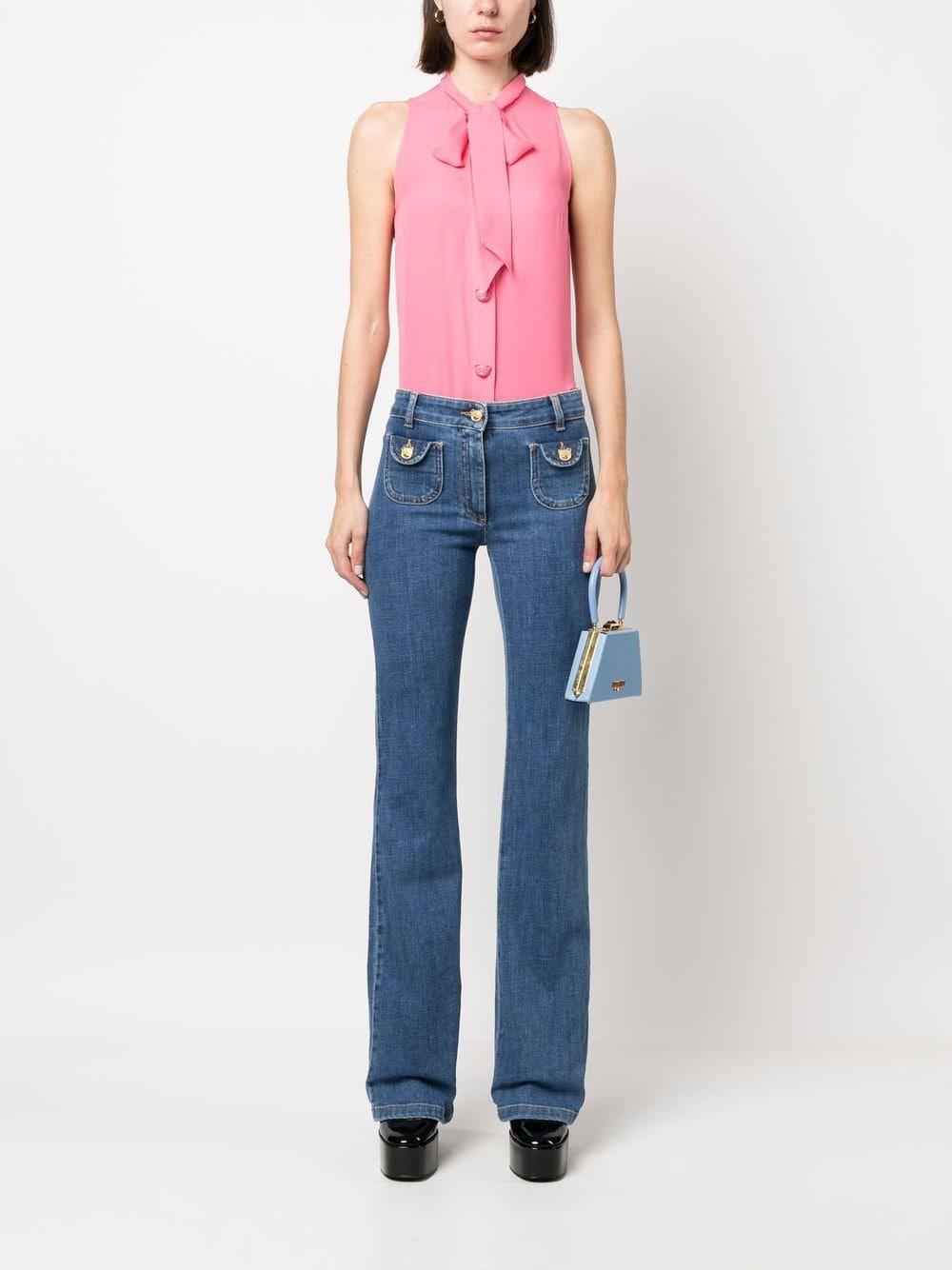 Jeans a zampa denim tasche teddy