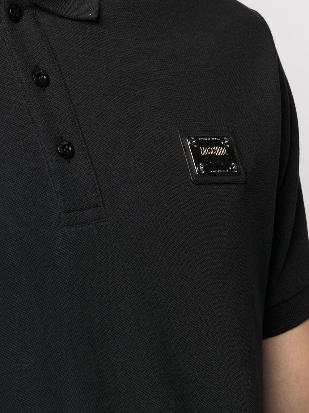 Polo nera mini placca logo petto