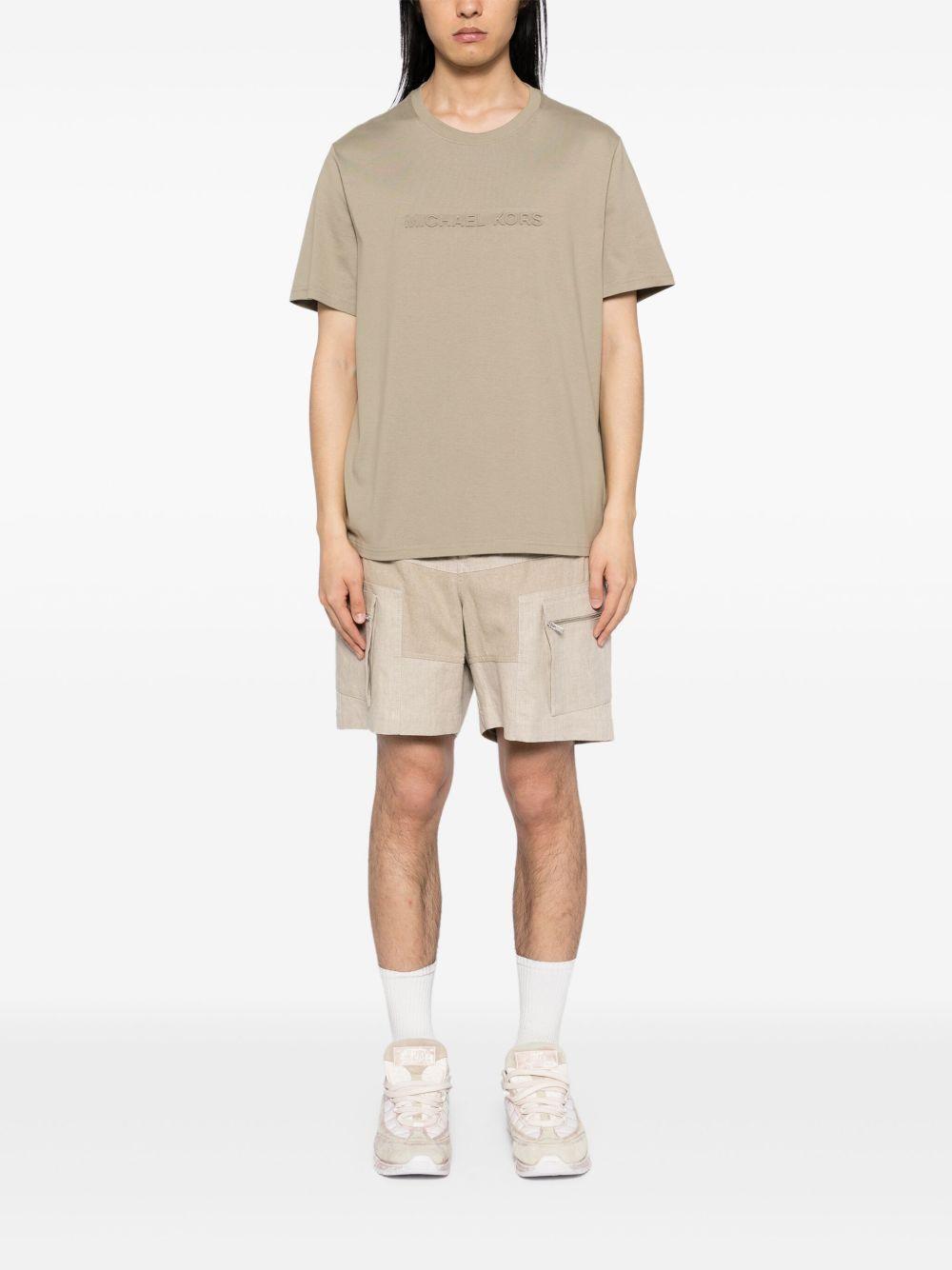 T-shirt beige logo lettering rilievo