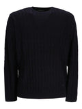 Black cable knit sweater with crew neck and long sleeves