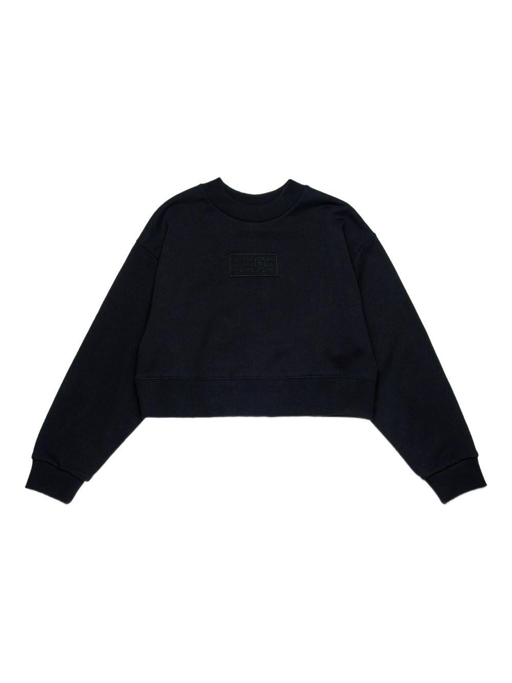 Felpa nera girocollo con applicazione frontale e logo numerico M60904MM04H M6900 MM6 MAISON MARGIELA KIDS 