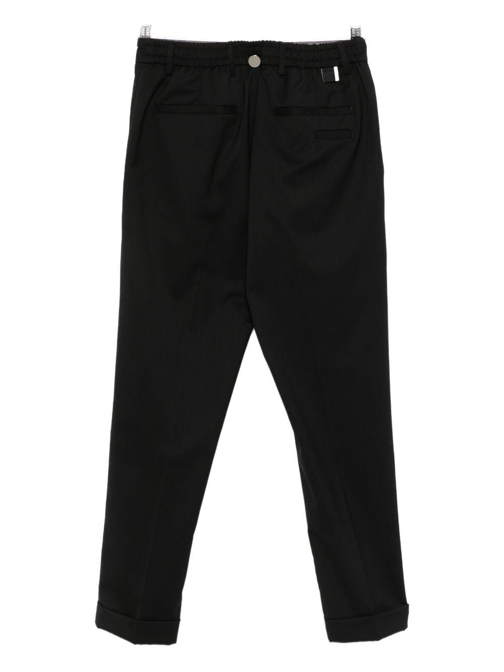 Pantaloni neri dritti con pieghe e chiusura frontale L1PFW25266920 D001 LOW BRAND 