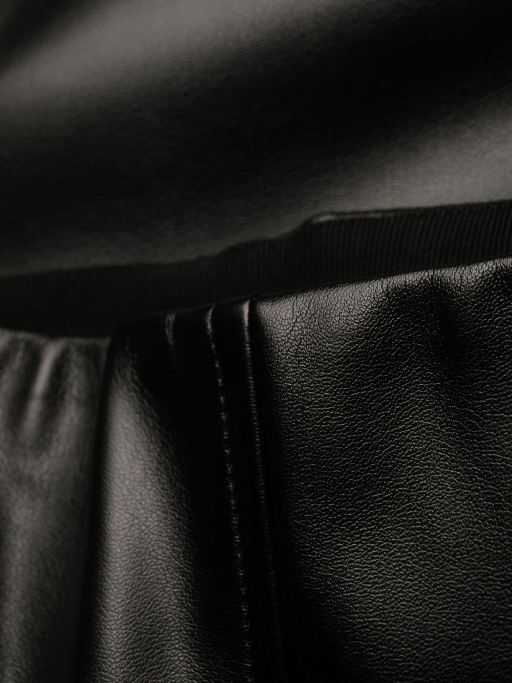 Pantalone nero zampa tessuto spalmato
