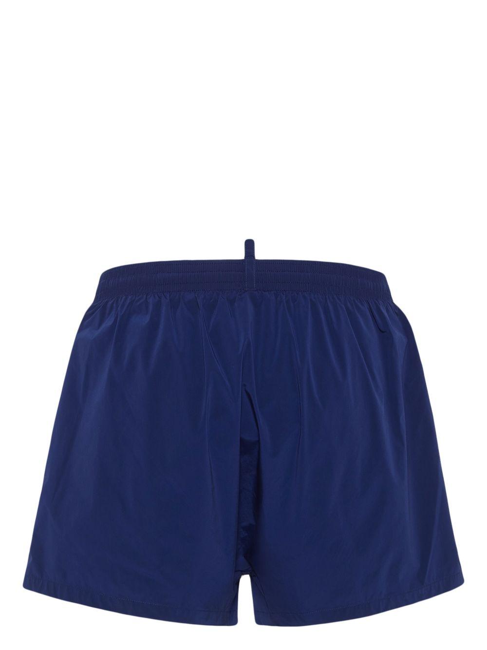 Costume boxer blu con bande laterali