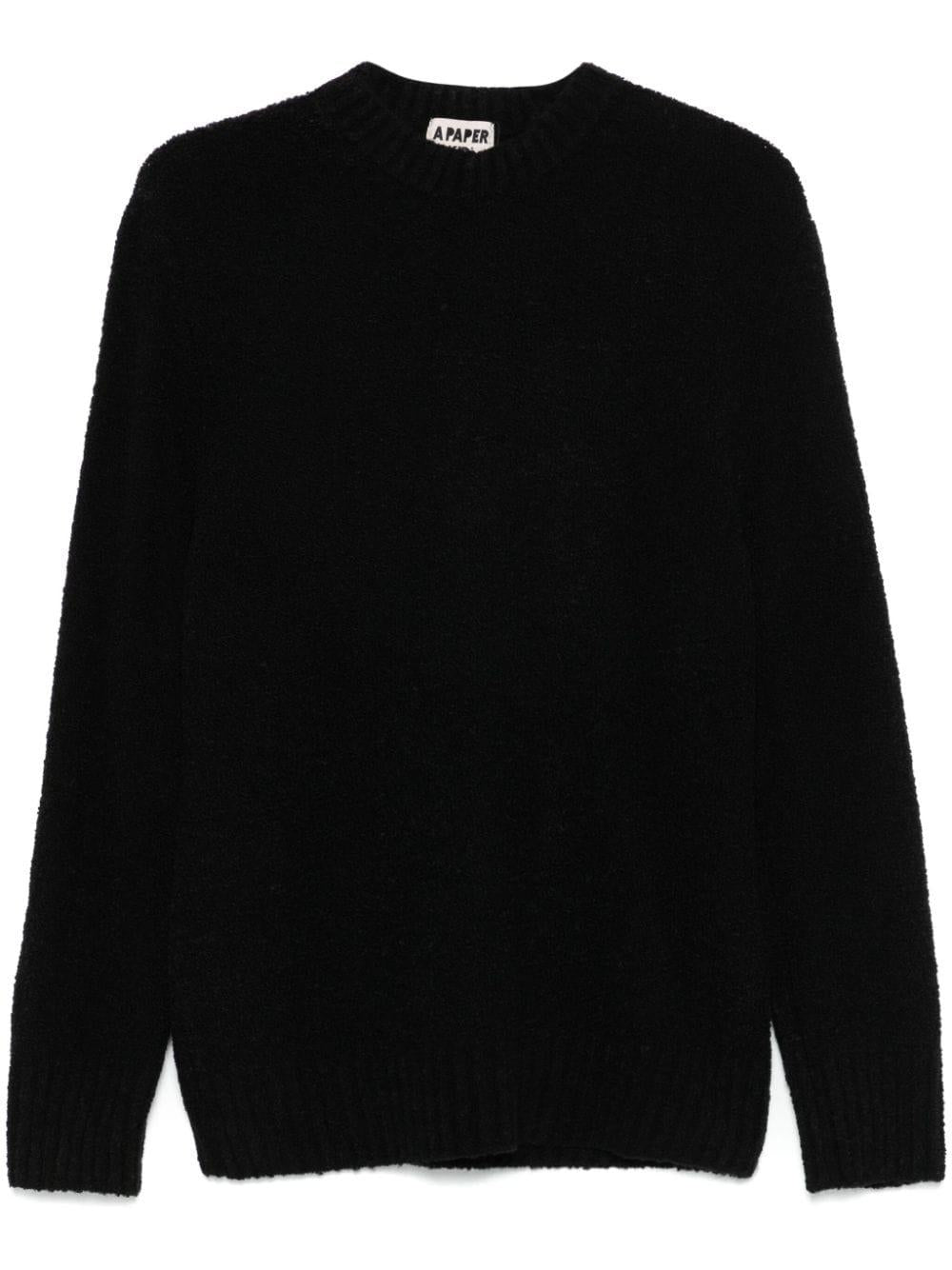Maglione nero con lavorazione bouclè