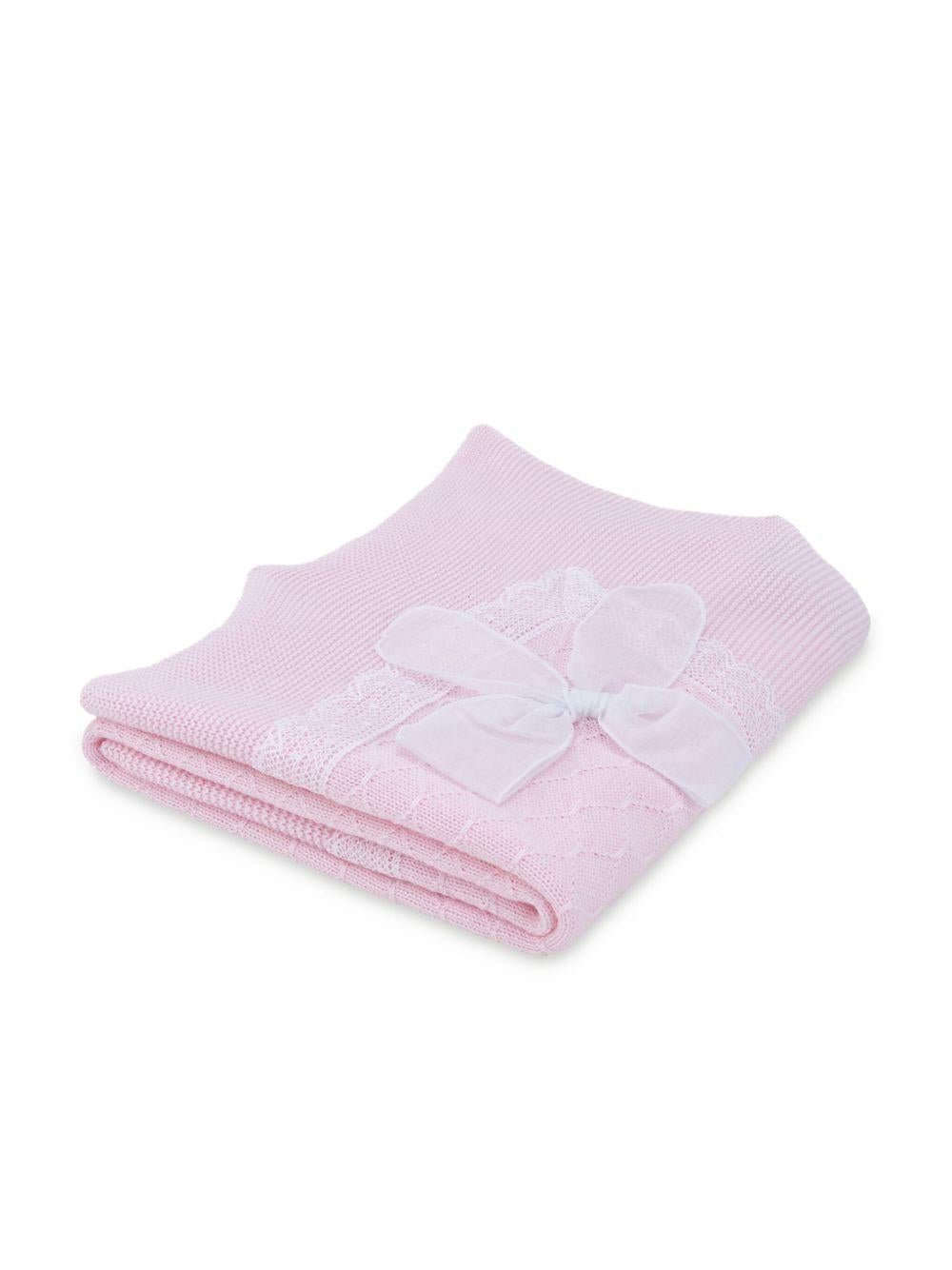 Coperta in maglia rosa con pizzo bianco