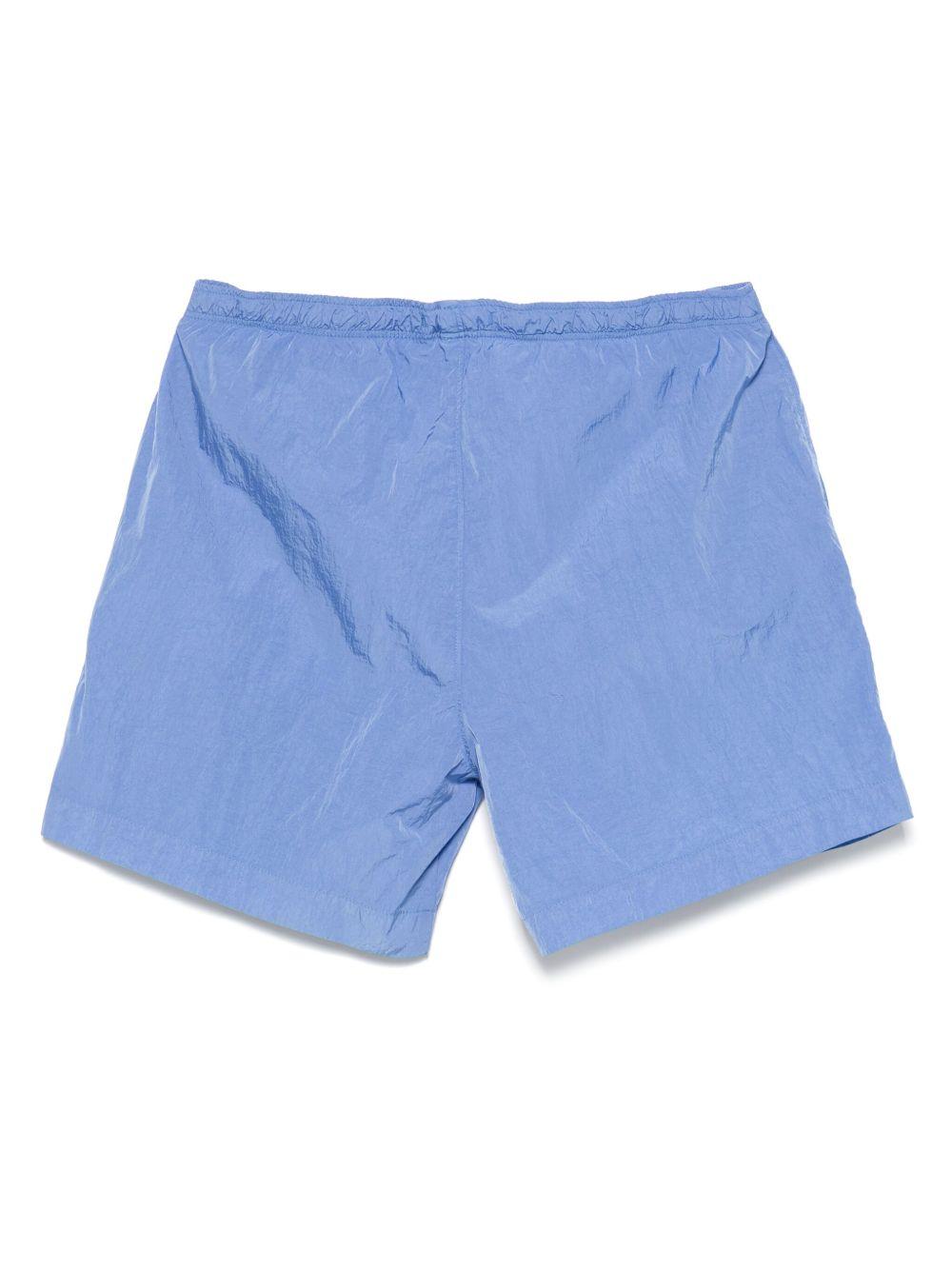 Costume boxer celeste con mini etichetta