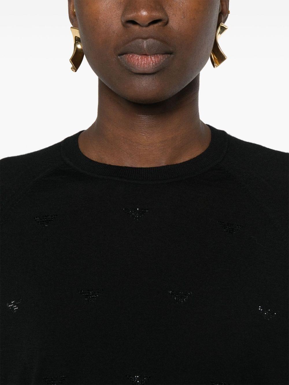 Maglione nero con mini loghi strass