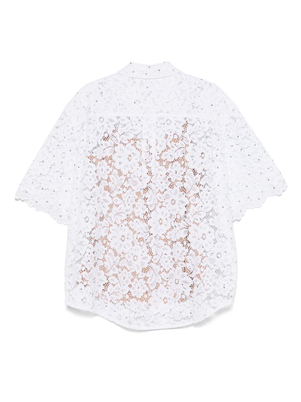 Camicia bianca ricamata con borchie