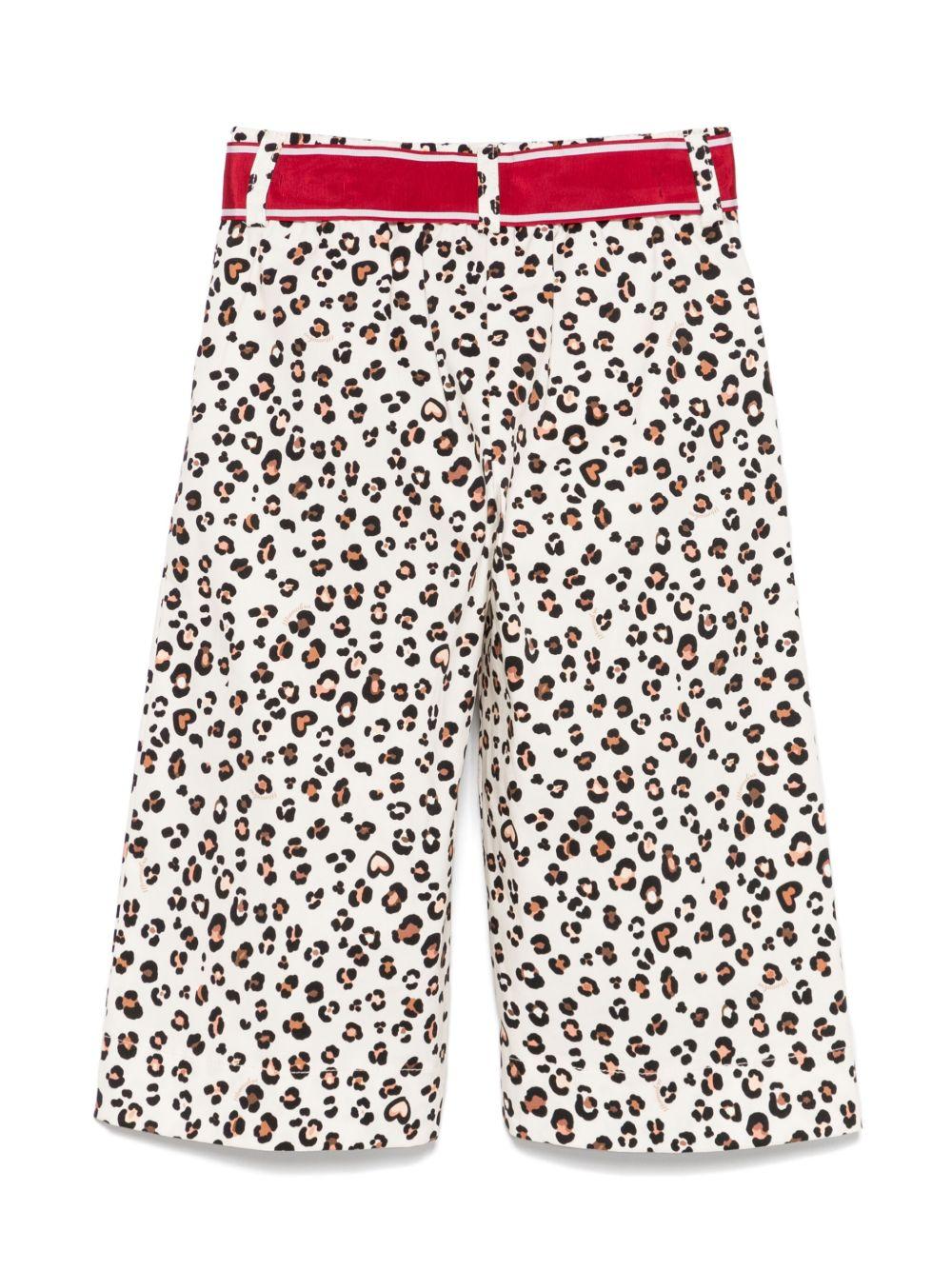 Pantalone leopardato con fiocco rosso