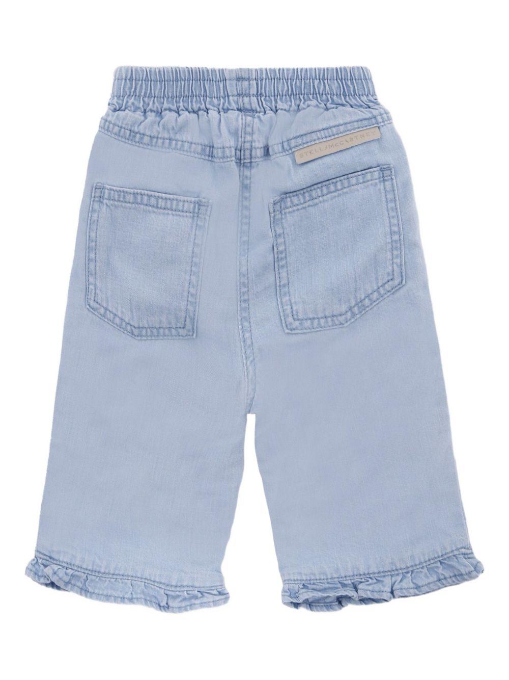 Jeans Azzurri con Ruches e Decorazioni a Fiori TX6020Z0522 606 STELLA MCCARTNEY KIDS 