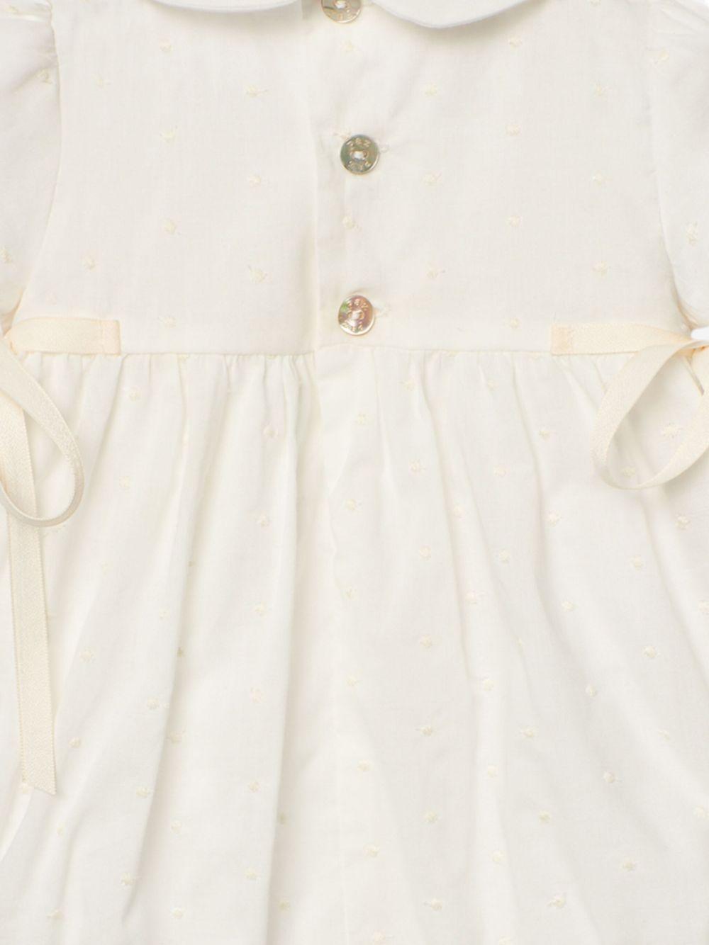 Tutina crema con ricami neonata