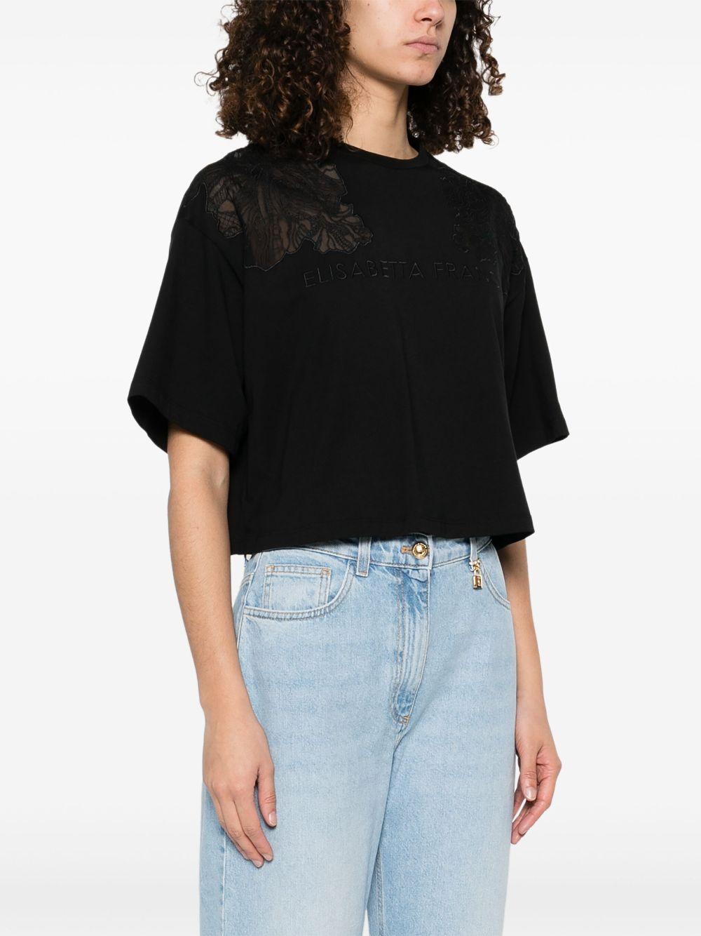T-shirt nera con ricami semitrasparenti e logo