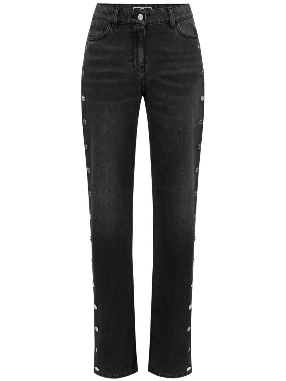 Jeans a gamba ampia nero con bottoni laterali