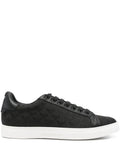 Black sneakers with eagle logo and lace-up closure
