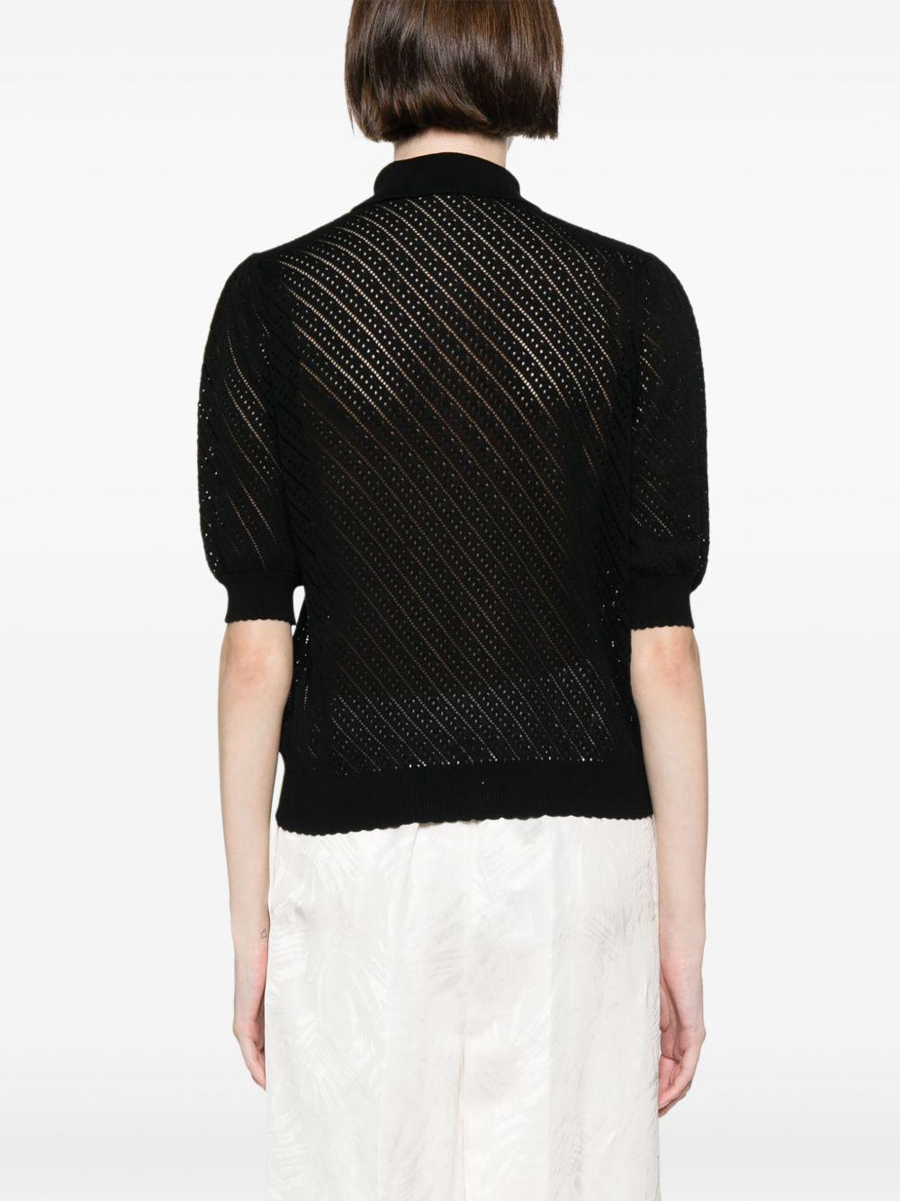 Maglia nera traforata con ricamo