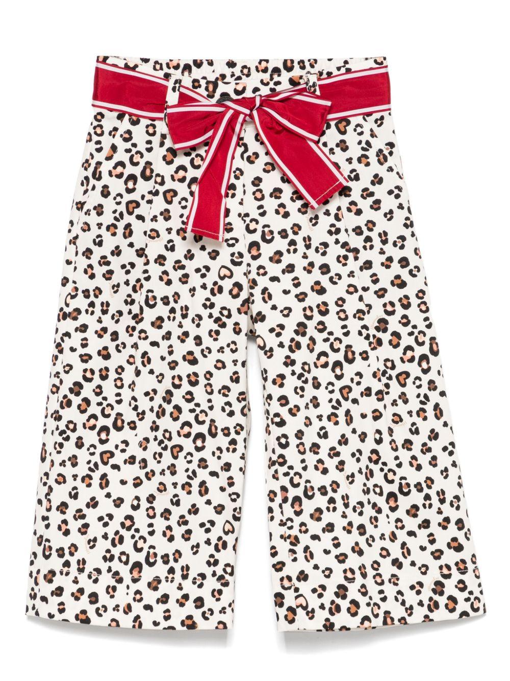 Pantalone leopardato con fiocco rosso