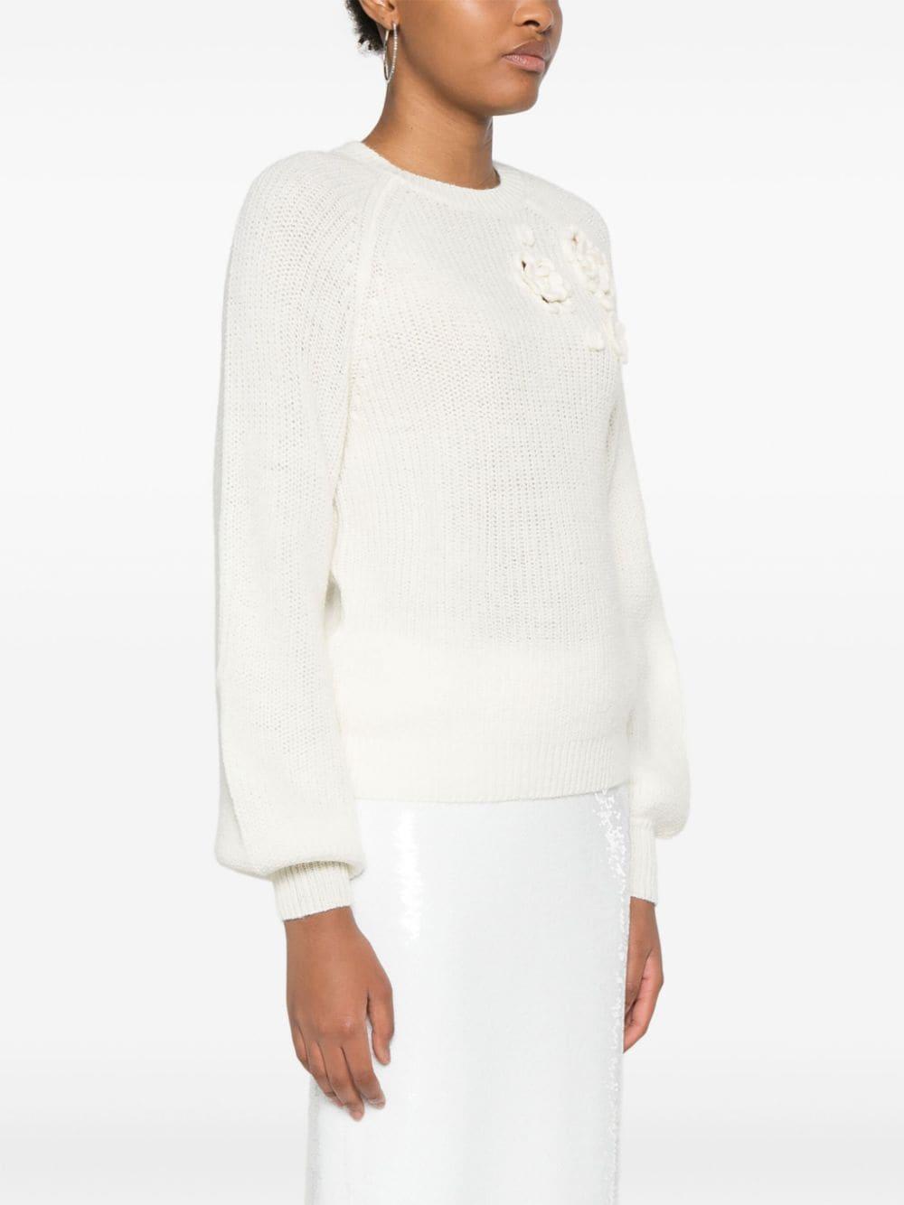 Maglione bianco con ricamo floreale