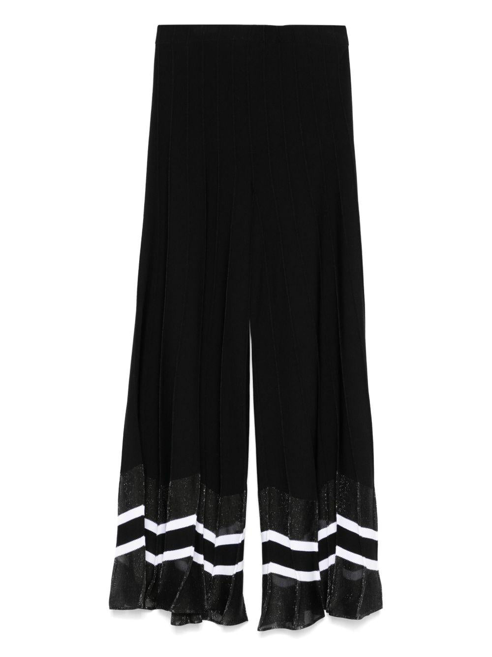 Pantalone nero a gamba ampia orlo chevron