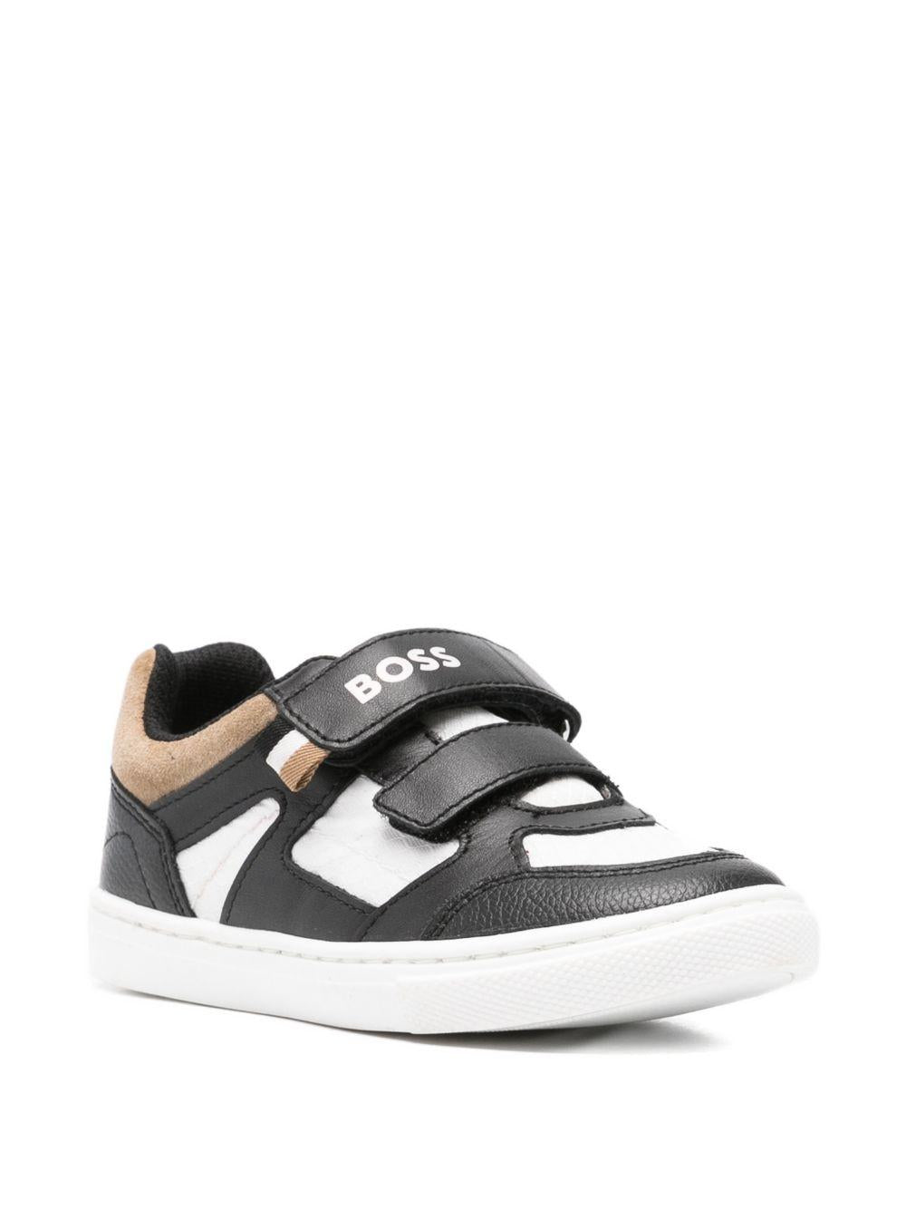 Sneakers in pelle con chiusure a strappo J52827 09B BOSS KIDSWEAR 