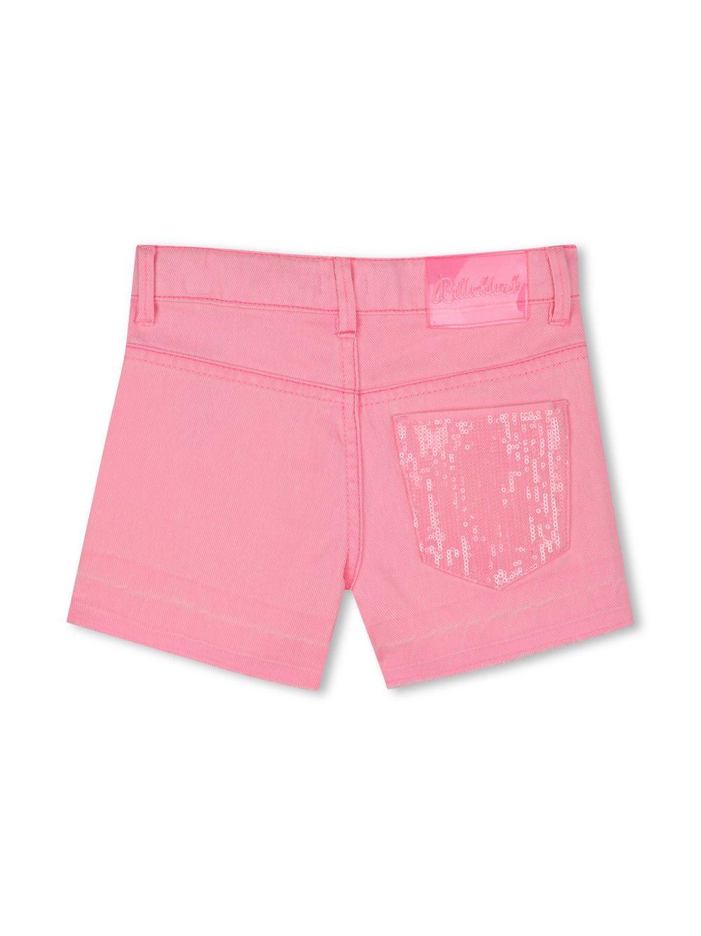 Short denim rosa con tasca in paillettes
